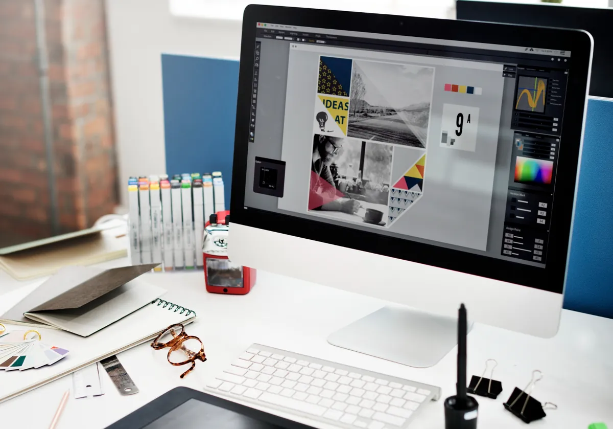 Designer working on a branding mood board on a desktop computer